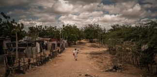 La Pista, el mayor asentamiento de migrantes de América sufre por los recortes de Trump: “Nos sentimos impotentes”